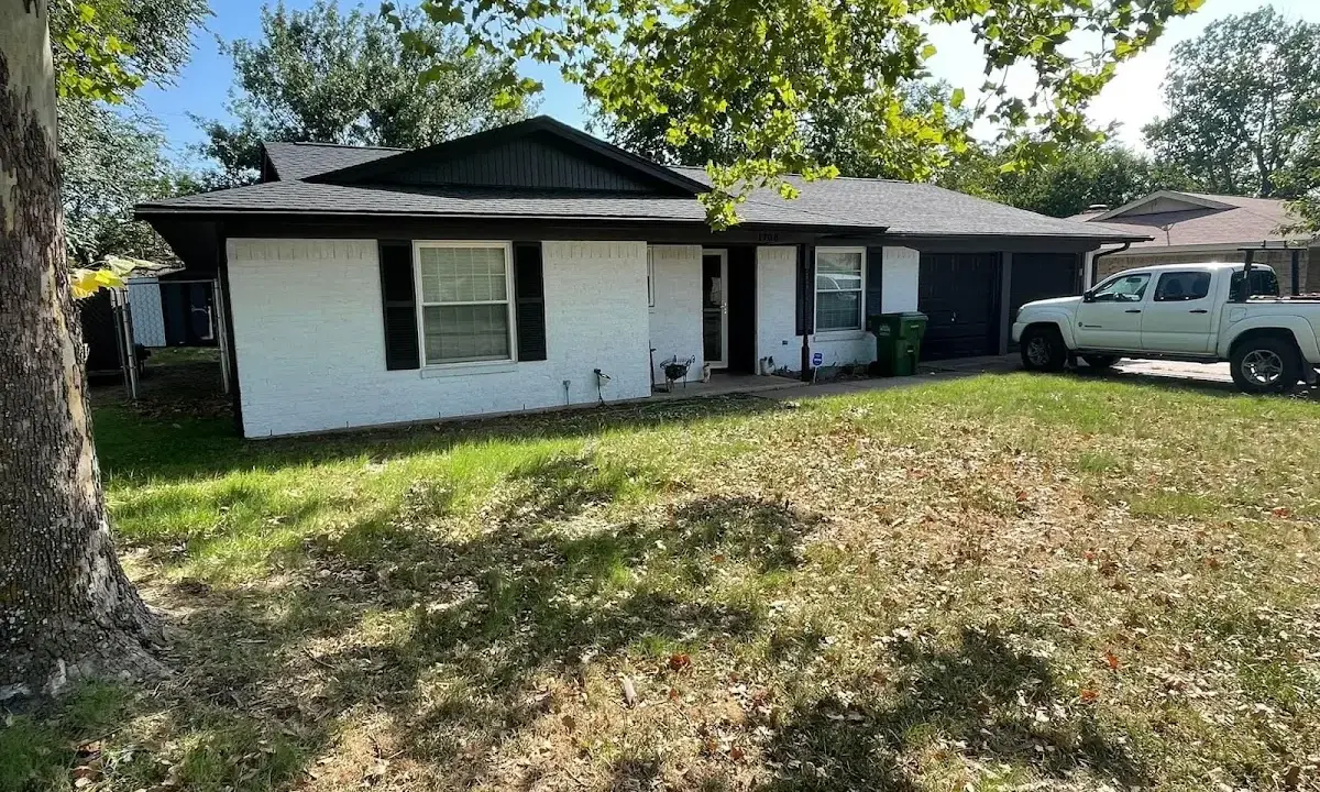 Professional roofing crew working on a residential roof in Vandalia